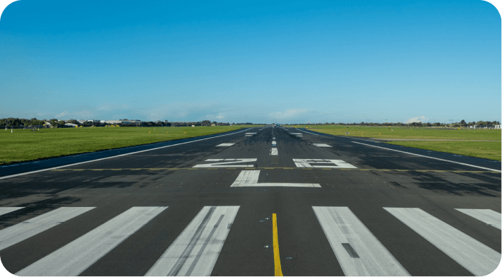 Airport runway with markings, lighting and airfield infrastructure